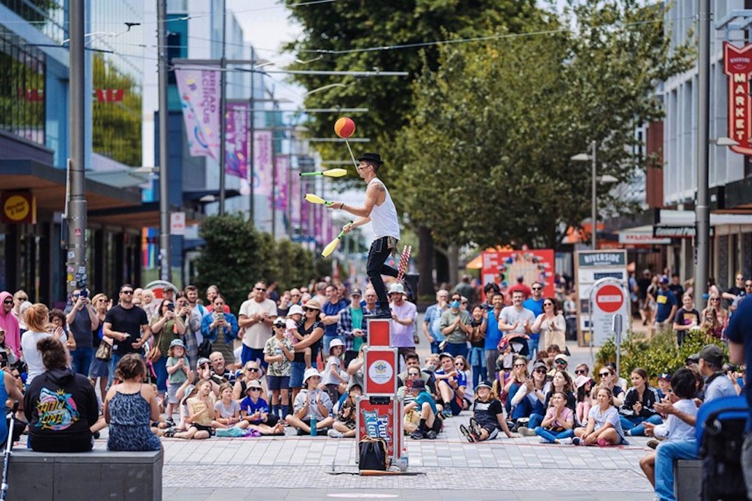 man busking in front of crowd